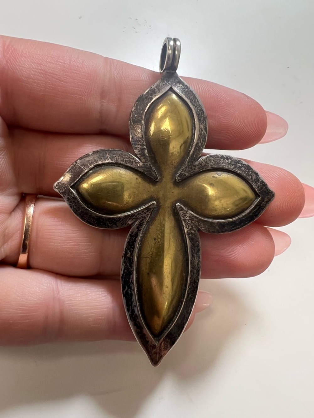 Retired James Avery cross pendant made of sterling silver and brass